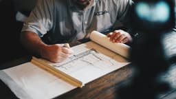 Architect drafting plans (new construction metaphor)